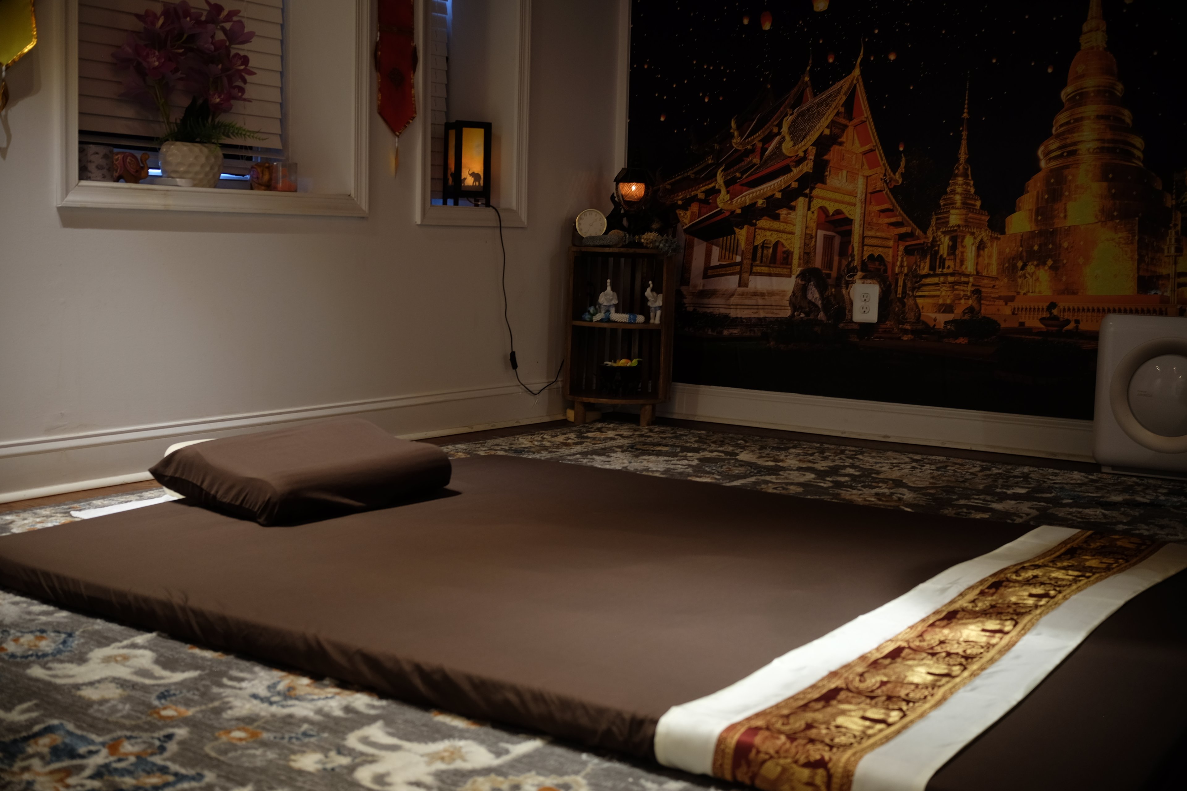 Traditional Thai massage room with authentic decor and serene atmosphere at Bloom Thai Therapy