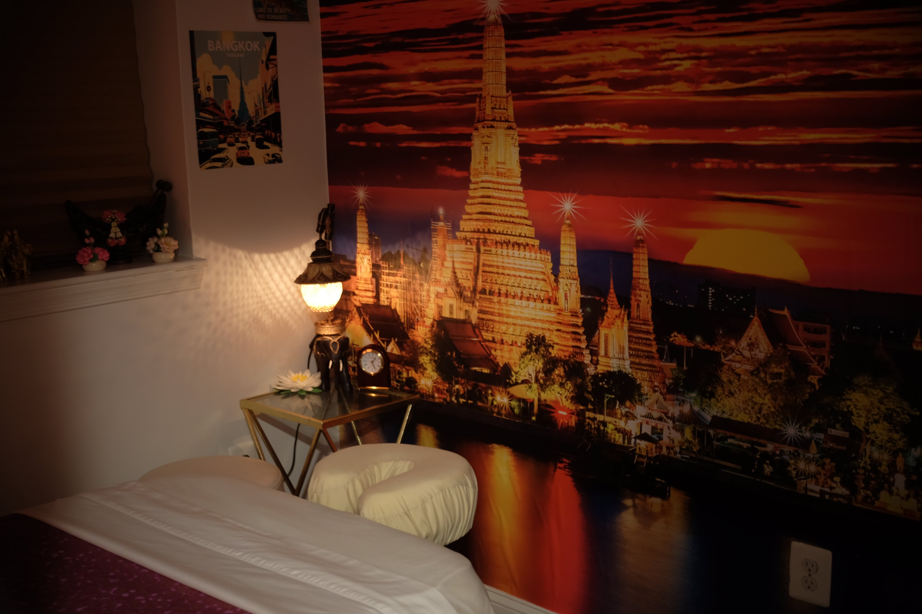 Treatment room featuring authentic Thai temple mural showcasing traditional Thai cultural atmosphere at Bloom Thai Therapy